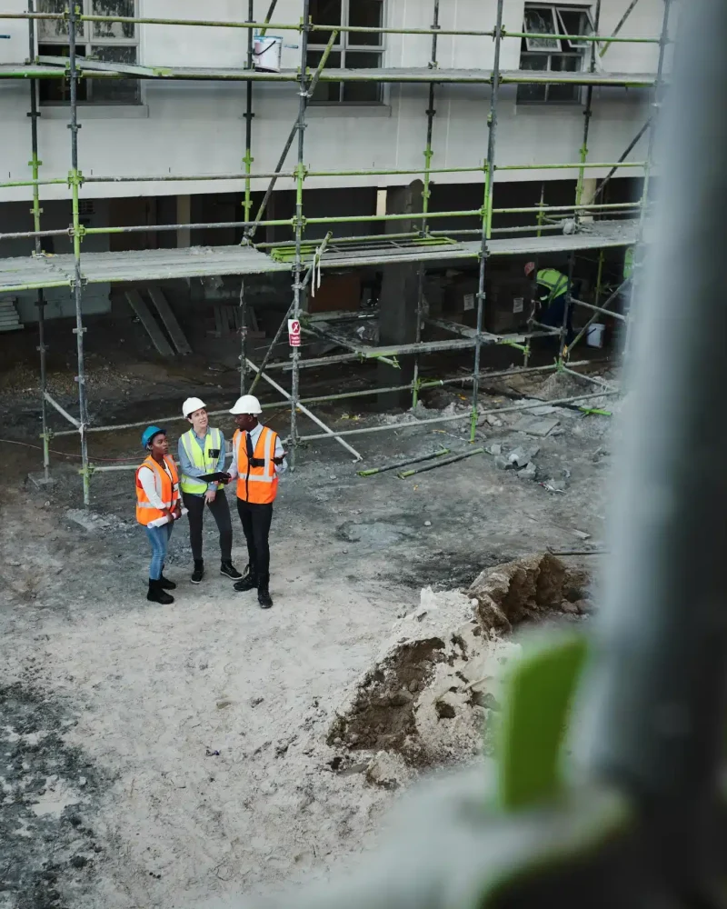 shot-of-a-group-of-building-contractors-having-a-d-2023-11-27-05-28-57-utc